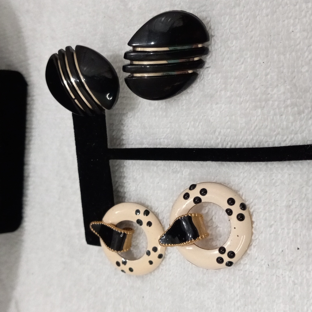 Two Pairs of Black, Gold , White Earrings.